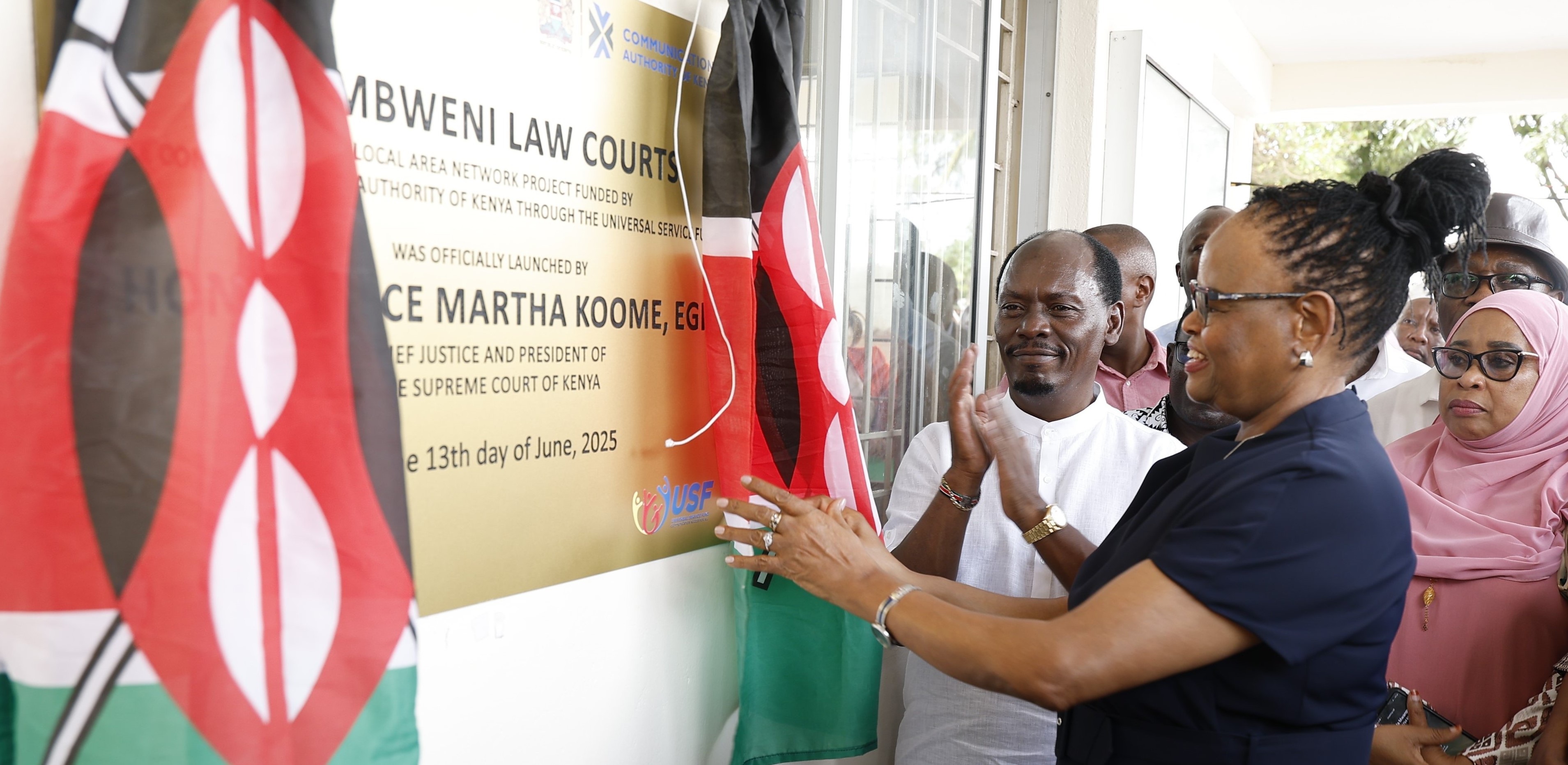 Chief Justice Martha Koome (right) unveils a plaque during the launch of the Local Area Network Project funded by CA through the Universal Service Fund