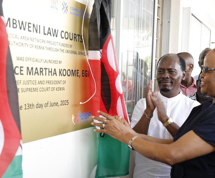 Chief Justice Martha Koome (right) unveils a plaque during the launch of the Local Area Network Project funded by CA through the Universal Service Fund
