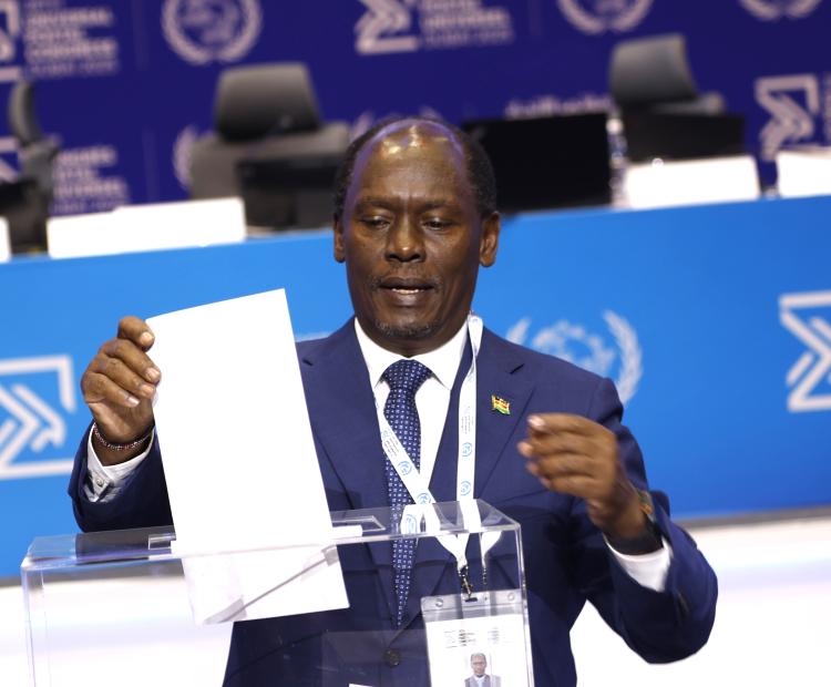 Information, Communications and the Digital Economy Cabinet Secretary Hon. William Kabogo casts a ballot during elections for various positions at the 28th Universal Postal Congress in Dubai, United Arab Emirates. During the elections, Kenya secured a four-year term to the Postal Operations Council, the technical and operation organ of the Universal Postal Union, the UN agency for postal services.